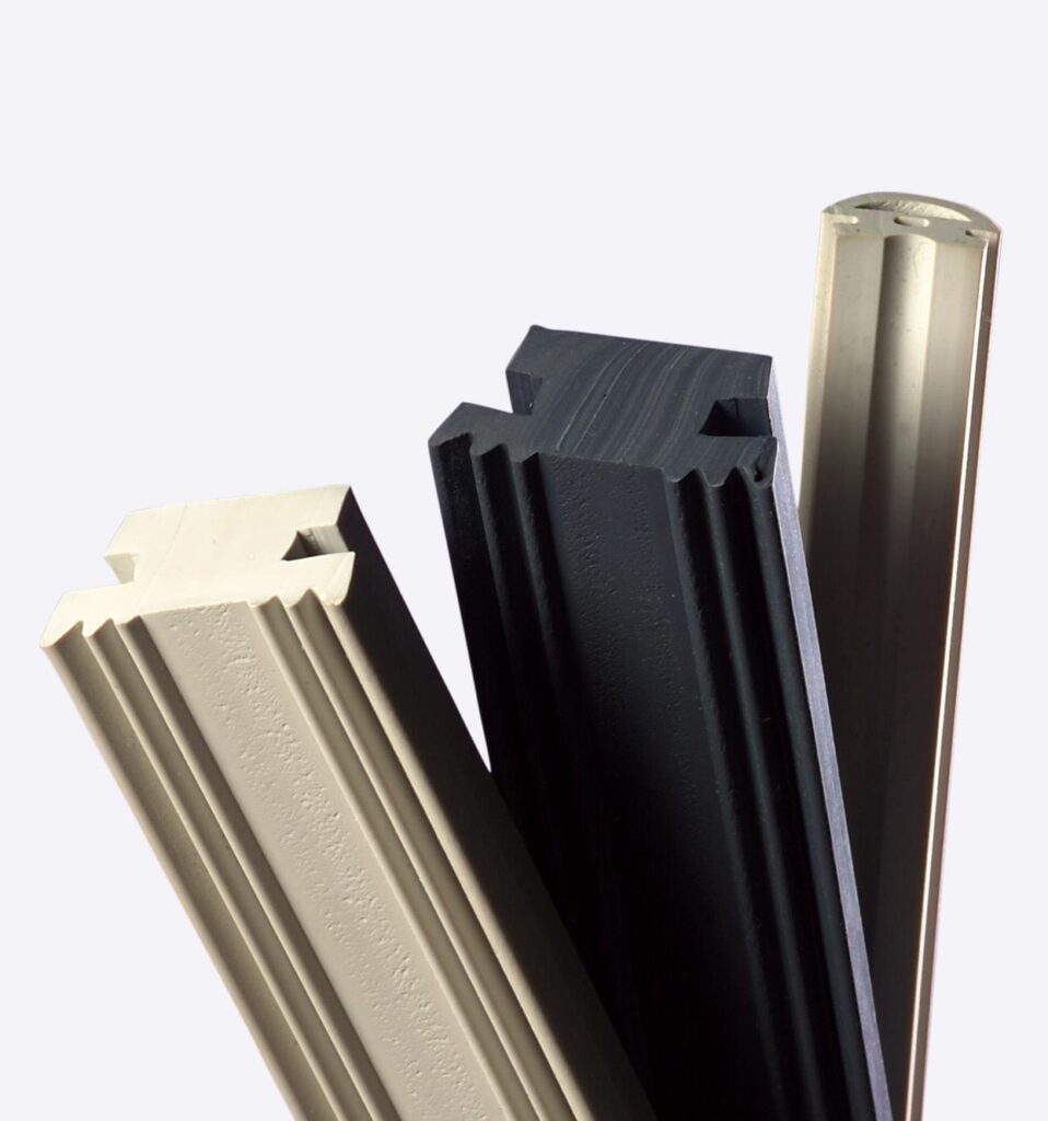 Three different rubber extrusion profiles, two in a cream colour and one in black.