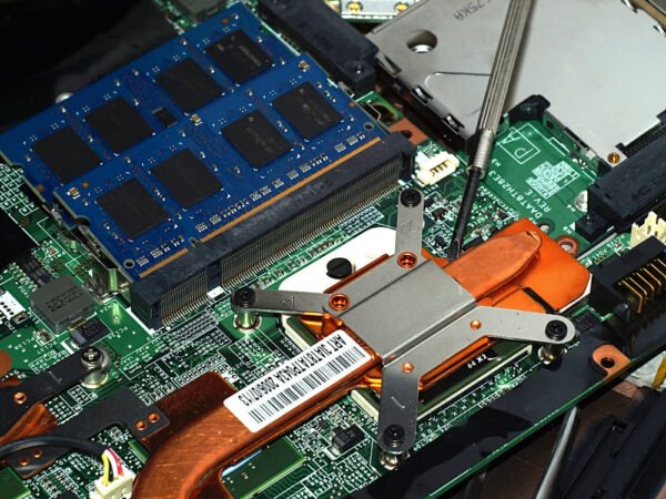 A laptop motherboard being built.
