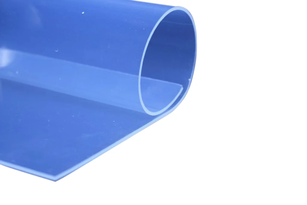 A light blue piece of rolled up 'Glass Clear' Silicone Sheeting.
