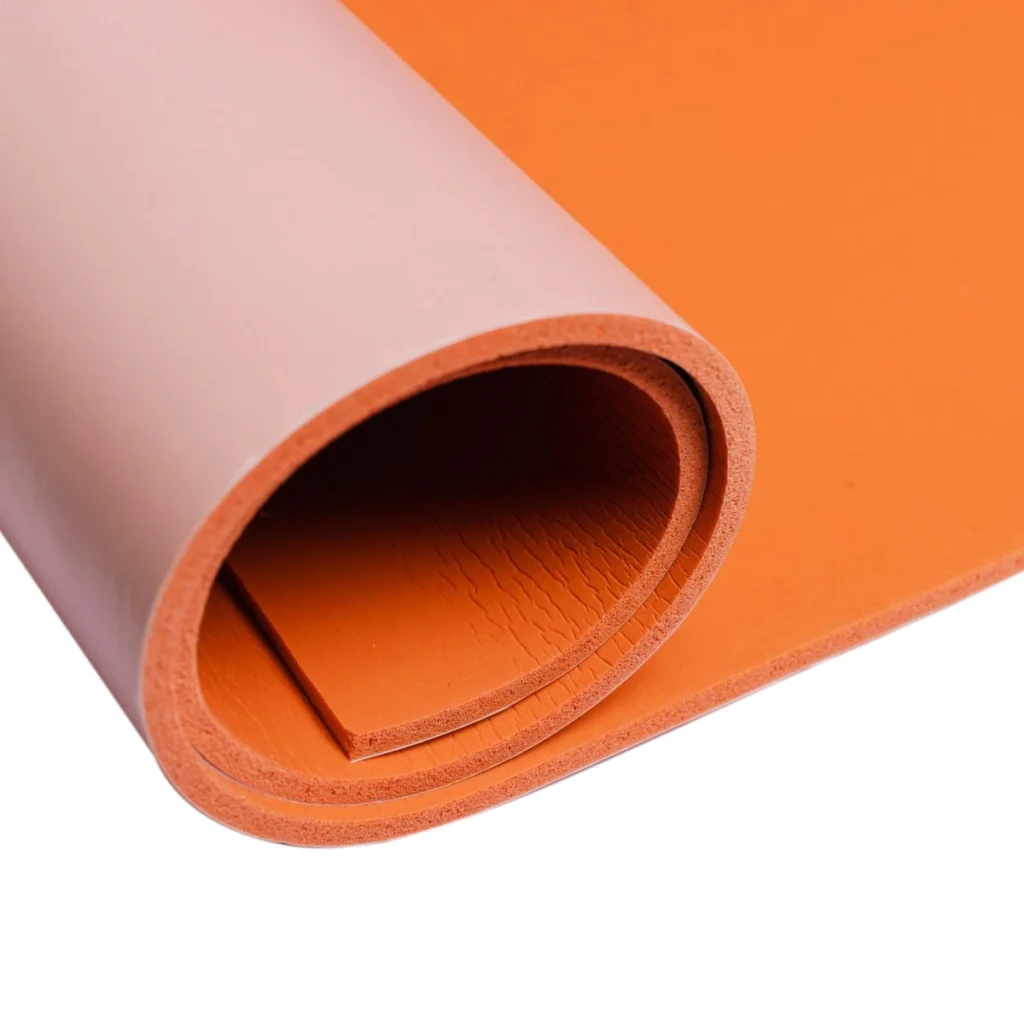 A roll of BISCO® HT870 Flame Retardant Silicone Sponge in orange.