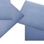 Multiple square pieces of fluorosilicone rubber sheeting scattered across a white background.