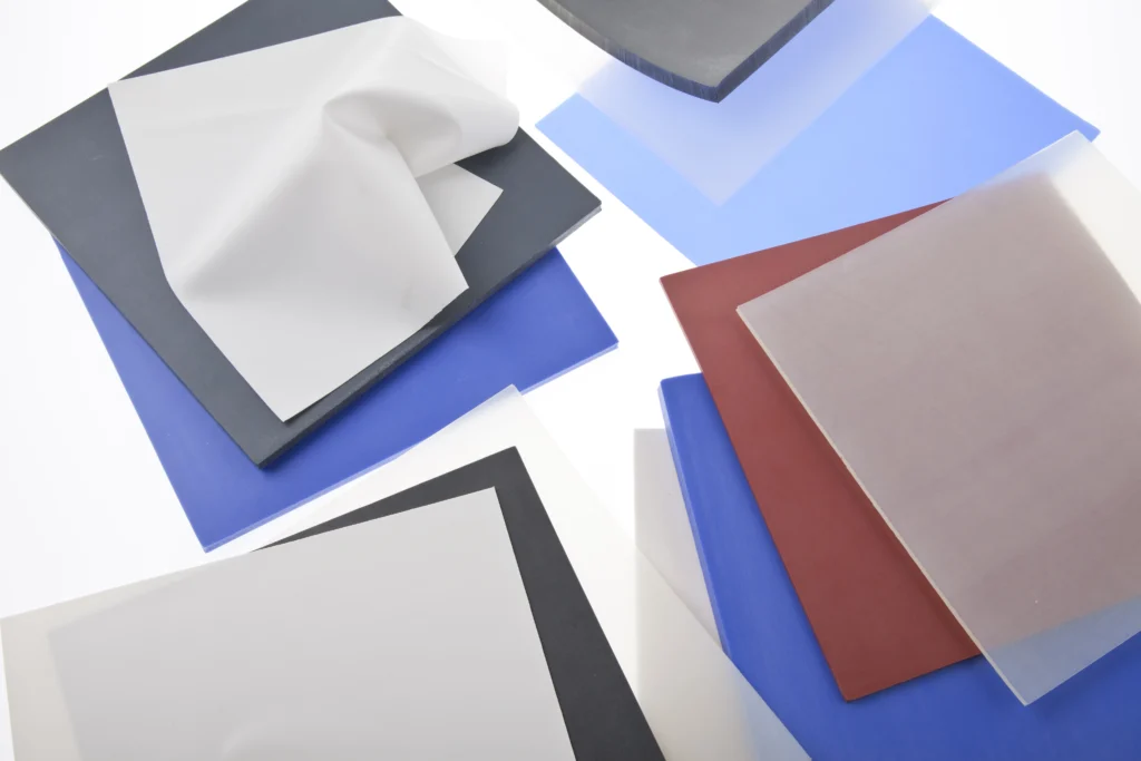 A close up of multiple piles of differently coloured, general purpose FDA silicone sheets.