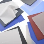 A close up of multiple piles of differently coloured, general purpose FDA silicone sheets.