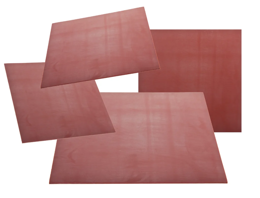 A collection of glass fibre reinforced silicone sheets on top of each other.