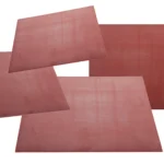 A collection of glass fibre reinforced silicone sheets on top of each other.