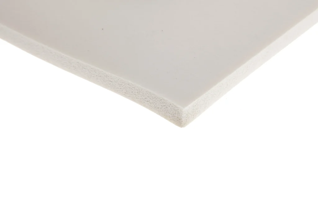 The corner of a sheet of high temperature silicone sponge in white.