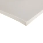 The corner of a sheet of high temperature silicone sponge in white.