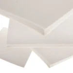 A stack of white high temperature silicone sponge sheets.