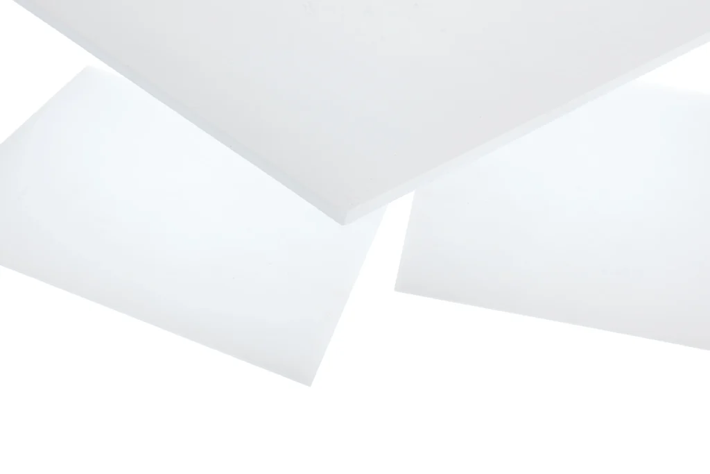 A staggered pile of vacuum grade silicone sheeting on top of each other.