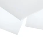 A staggered pile of vacuum grade silicone sheeting on top of each other.